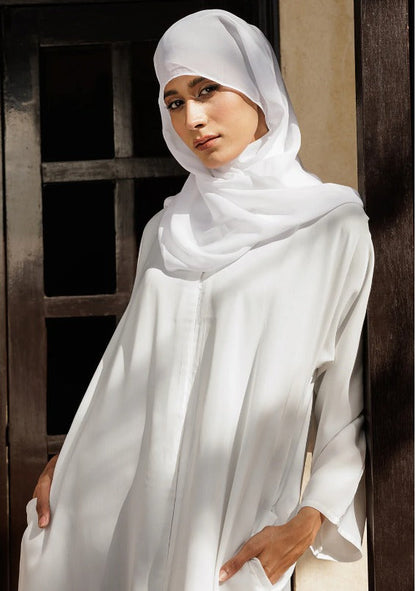 Elegant white abaya with button-down front design