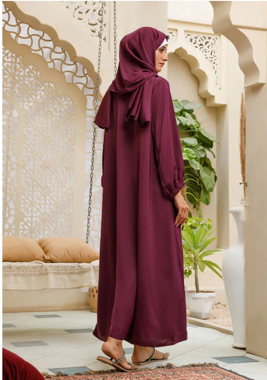 Maroon abaya paired with hijab for Gulf modest style